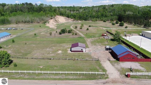 drone / aerial view with a rural view and a wooded view