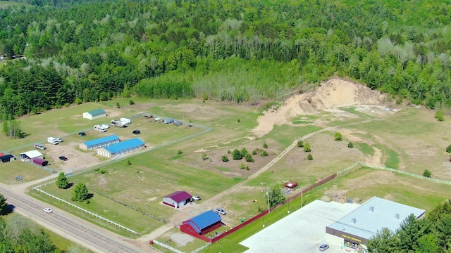 drone / aerial view with a view of trees