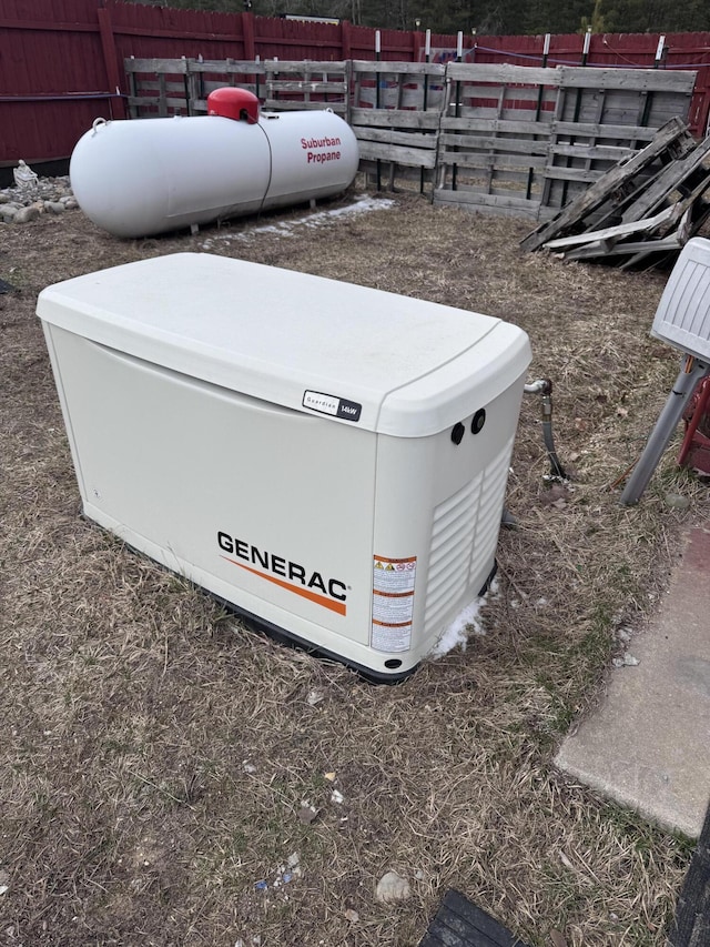 exterior details with a power unit, fence, and heating fuel