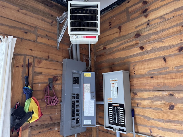 utility room with electric panel and a heating unit