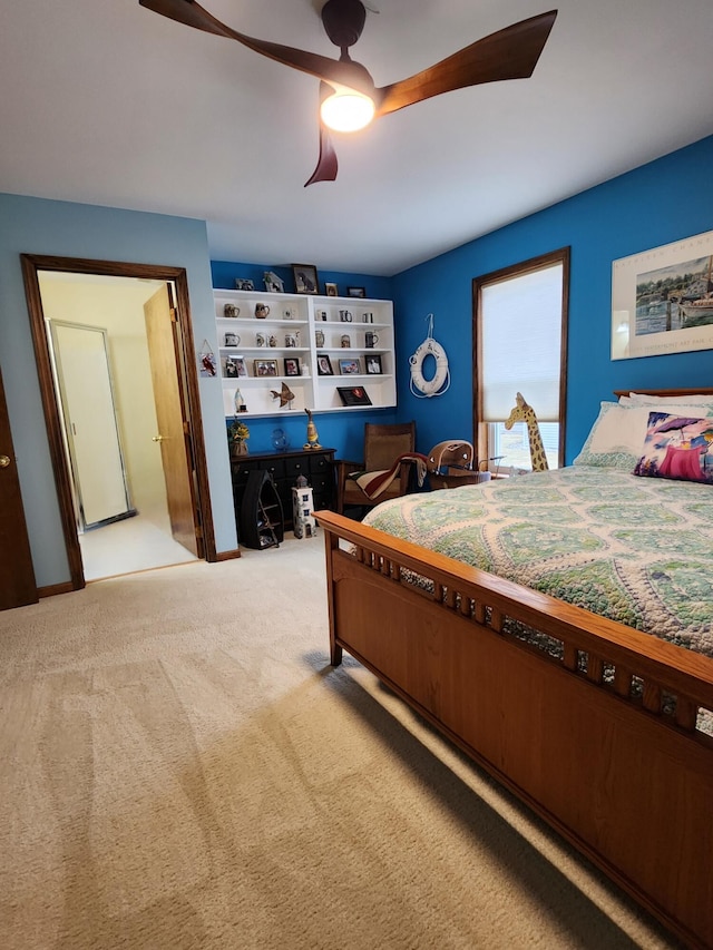 bedroom with a ceiling fan and carpet floors