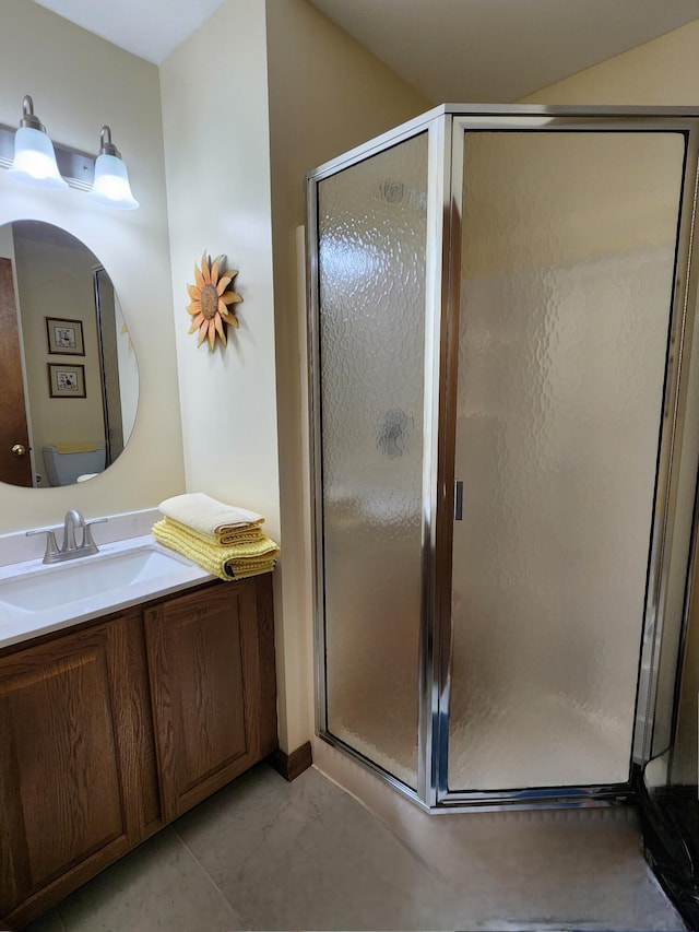 full bath with a shower stall, vanity, and marble finish floor