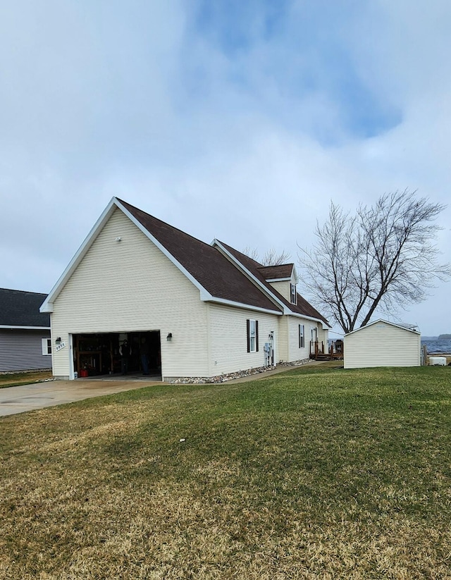 view of side of home featuring a yard and driveway