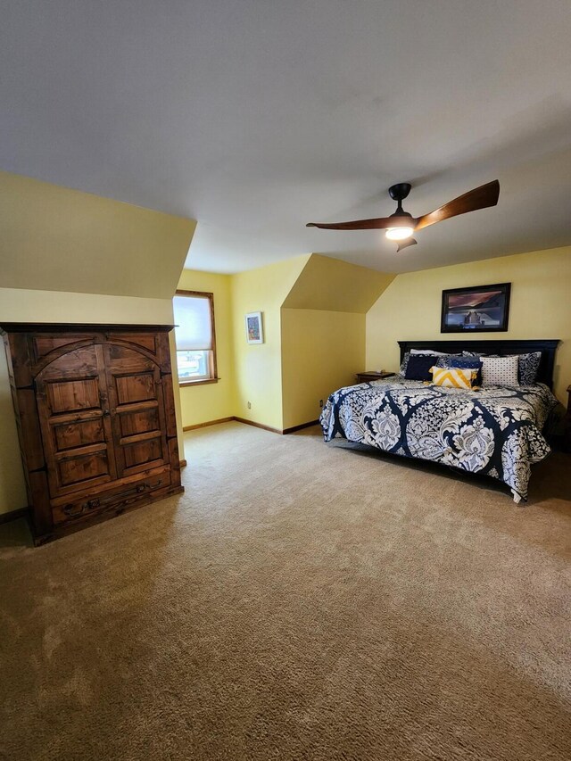 bedroom featuring ceiling fan, baseboards, and carpet