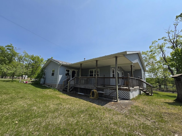1793 W Kittle Rd, Mio, MI 48647 - rear view of house featuring a yard