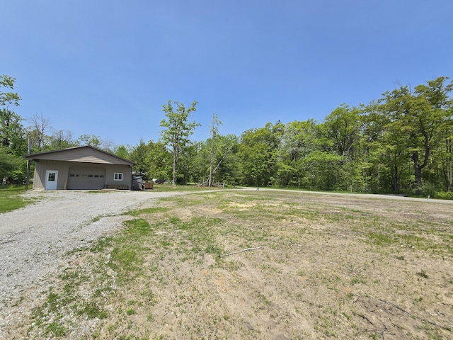 1793 W Kittle Rd, Mio, MI 48647 - view of yard featuring a garage and an outbuilding