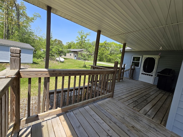 1793 W Kittle Rd, Mio, MI 48647 - wooden deck with a lawn and area for grilling