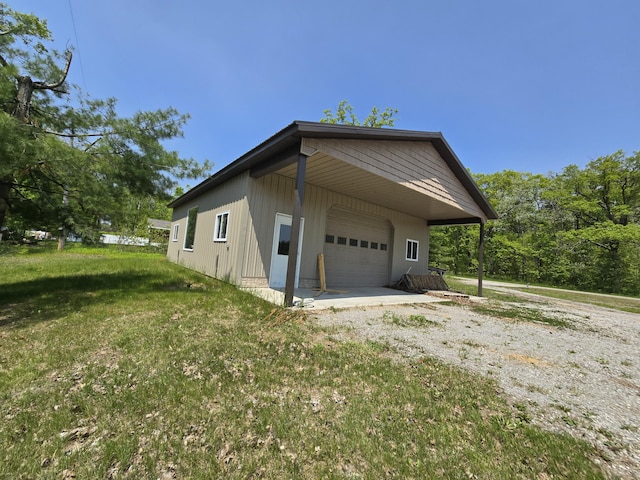 1793 W Kittle Rd, Mio, MI 48647 - view of side of property featuring a garage and a yard