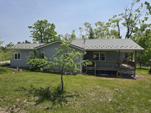1793 W Kittle Rd, Mio, MI 48647 - rear view of house with a yard and a wooden deck