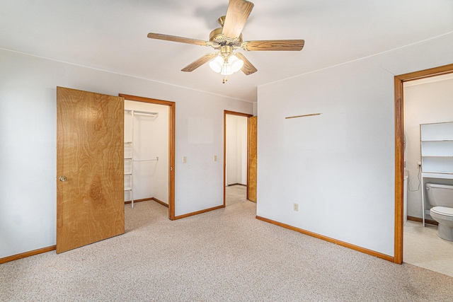 4640 Hiawatha Dr, Cheboygan, MI 49721 - unfurnished bedroom featuring a walk in closet, baseboards, a closet, and carpet