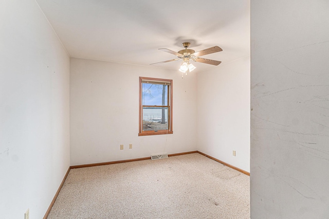4640 Hiawatha Dr, Cheboygan, MI 49721 - carpeted empty room with baseboards, a ceiling fan, and visible vents