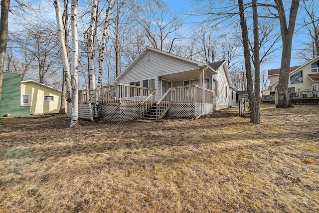 4640 Hiawatha Dr, Cheboygan, MI 49721 - view of front facade with a wooden deck