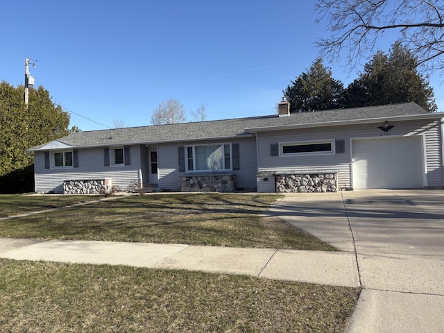 ranch-style house with an attached garage, a chimney, driveway, and a front yard