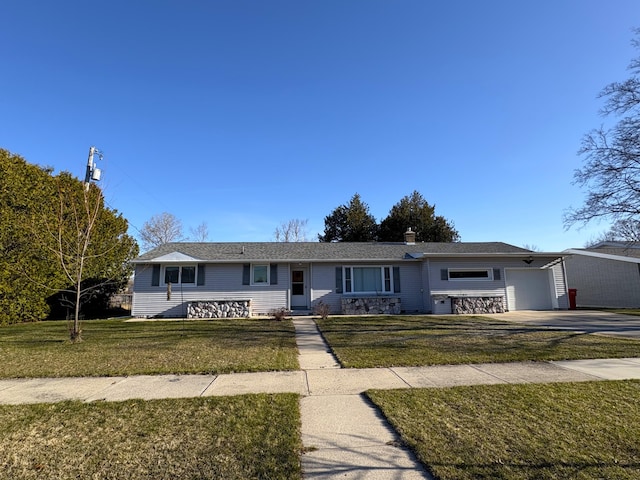 ranch-style home featuring concrete driveway, a chimney, a front lawn, and a garage