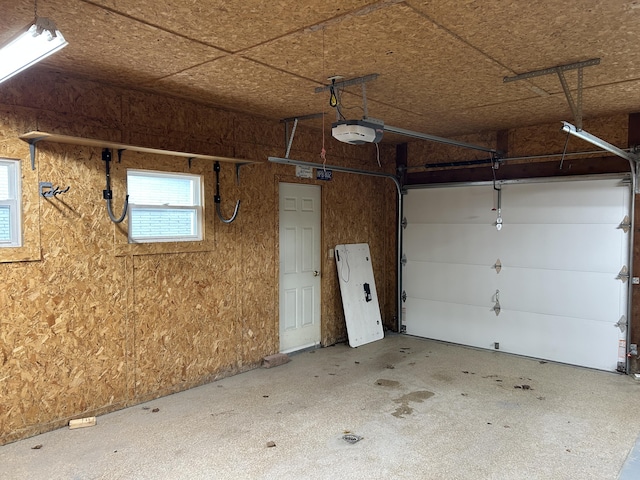 2141 S First Ave, Alpena, MI 49707 - garage featuring a garage door opener