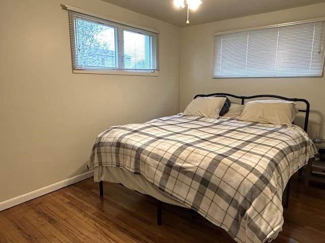 2141 S First Ave, Alpena, MI 49707 - bedroom featuring baseboards and wood finished floors