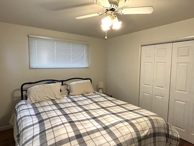2141 S First Ave, Alpena, MI 49707 - bedroom with a ceiling fan, dark wood-style floors, and a closet