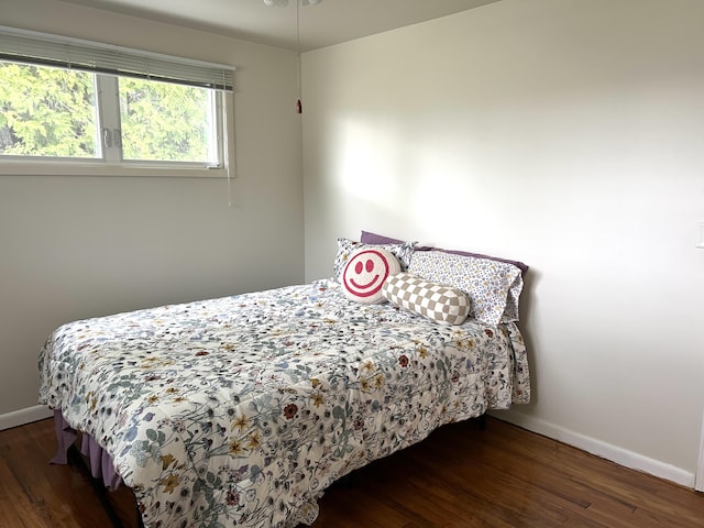 2141 S First Ave, Alpena, MI 49707 - bedroom with baseboards and wood finished floors