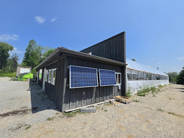 1300 N Perry Creek Rd, Fairview, MI 48621 - view of home's exterior featuring an outdoor structure