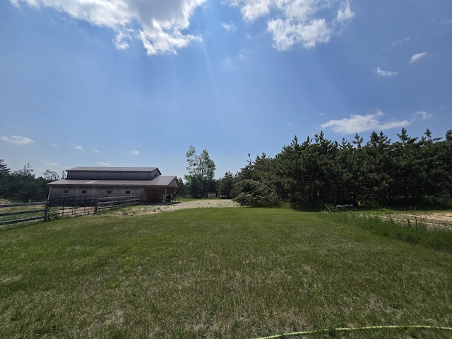 1300 N Perry Creek Rd, Fairview, MI 48621 - view of yard with a pole building, an outbuilding, and a view of countryside