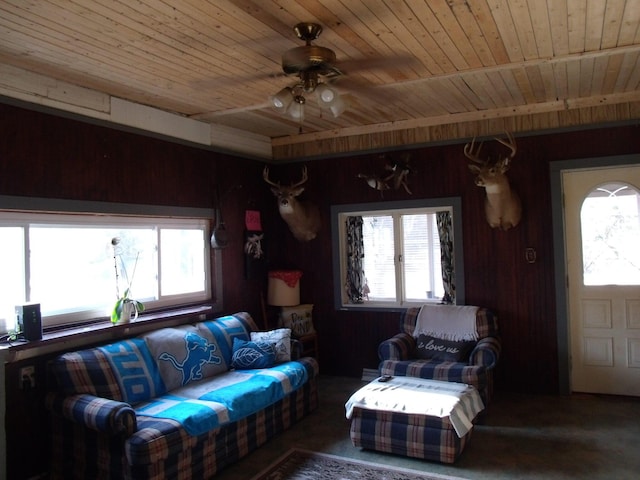 3468 W Nye Rd, Hessel, MI 49745 - living room with wooden ceiling, healthy amount of natural light, ceiling fan, and wood walls