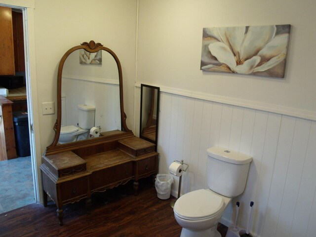 3468 W Nye Rd, Hessel, MI 49745 - half bath with wood finished floors, wainscoting, toilet, and vanity