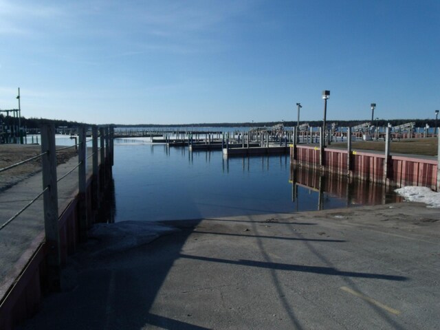 3468 W Nye Rd, Hessel, MI 49745 - dock featuring a boat ramp and a water view