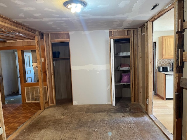 unfinished basement featuring visible vents