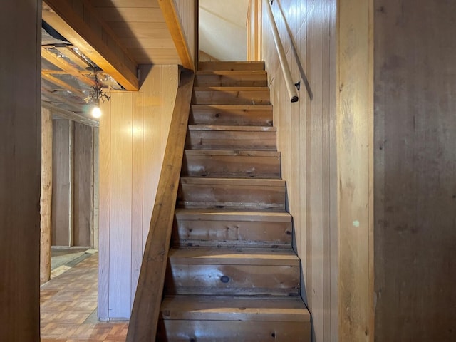 stairway with wooden walls