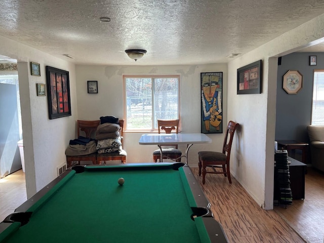playroom with visible vents, plenty of natural light, wood finished floors, and billiards
