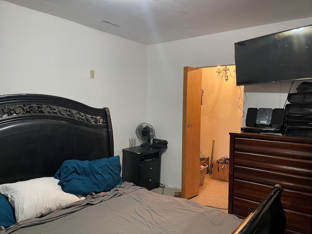 bedroom with carpet and visible vents