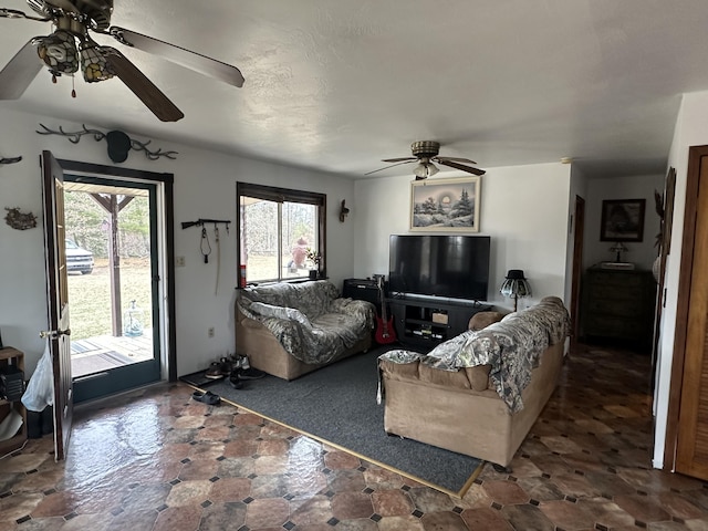 living area with ceiling fan