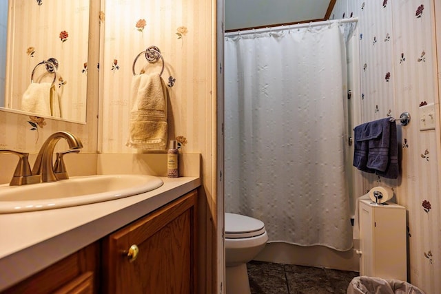 bathroom featuring toilet and vanity