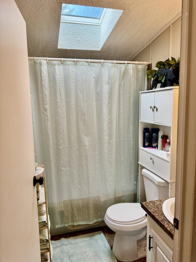 10525 Alpenhof Dr, Grayling, MI 49738 - bathroom featuring a textured ceiling, a skylight, toilet, shower / tub combo, and vanity