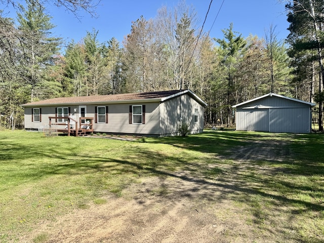 10525 Alpenhof Dr, Grayling, MI 49738 - back of property featuring a lawn and a wooden deck