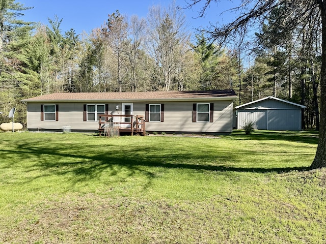 10525 Alpenhof Dr, Grayling, MI 49738 - back of house featuring a deck and a lawn