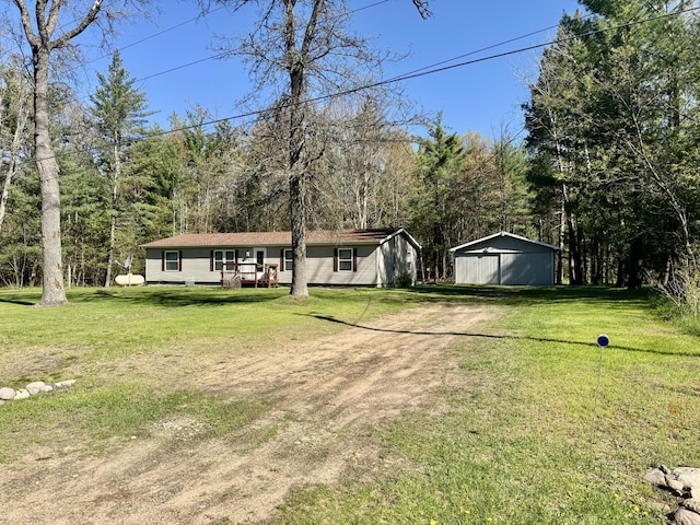 10525 Alpenhof Dr, Grayling, MI 49738 - view of front of home featuring a front lawn, an outbuilding, and driveway