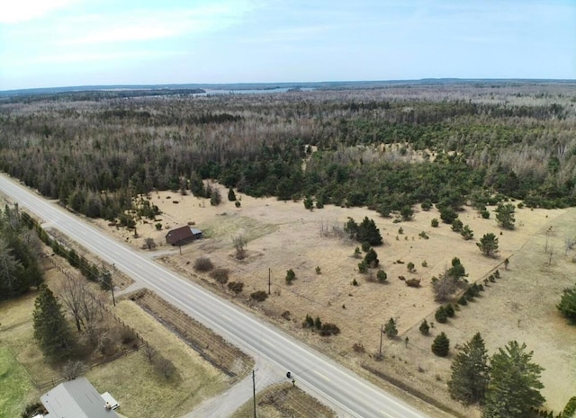 aerial view featuring a view of trees