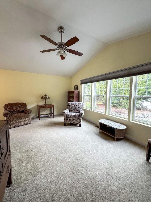 1220 N Lake Huron Shore Dr, Harrisville, MI 48740 - living area featuring vaulted ceiling, ceiling fan, and carpet flooring