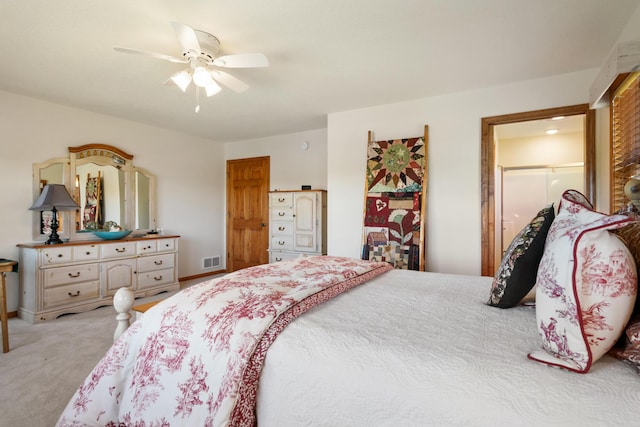 carpeted bedroom with a ceiling fan and visible vents