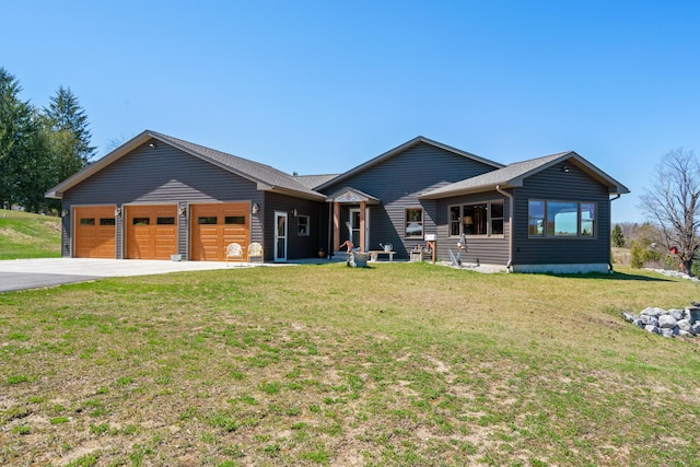 view of front of property with driveway, a garage, and a front yard