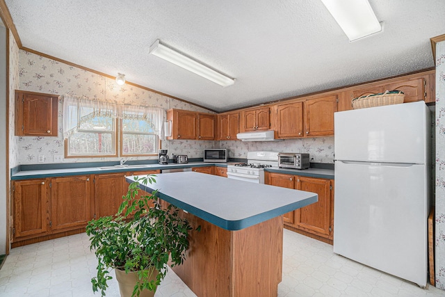 1580 Bancroft St, Cheboygan, MI 49721 - kitchen with wallpapered walls, lofted ceiling, light floors, a sink, and white appliances