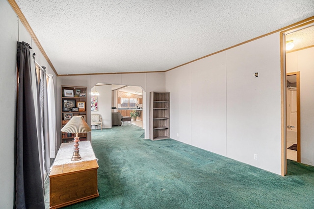 1580 Bancroft St, Cheboygan, MI 49721 - unfurnished room with arched walkways, ornamental molding, carpet flooring, and a textured ceiling