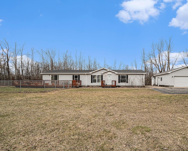 1580 Bancroft St, Cheboygan, MI 49721 - view of front of house with fence, aphalt driveway, and a front yard