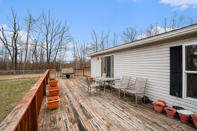 1580 Bancroft St, Cheboygan, MI 49721 - wooden terrace with a yard, fence, and outdoor dining space
