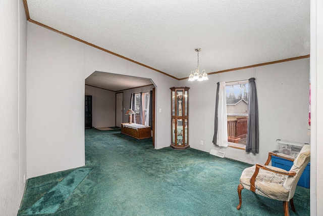 1580 Bancroft St, Cheboygan, MI 49721 - unfurnished room with an inviting chandelier, vaulted ceiling, ornamental molding, arched walkways, and carpet floors