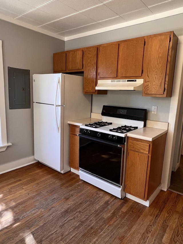 317 Pine Hill Ave, Cheboygan, MI 49721 - kitchen with gas range oven, under cabinet range hood, brown cabinets, and electric panel