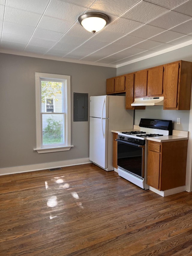 317 Pine Hill Ave, Cheboygan, MI 49721 - kitchen featuring gas range oven, brown cabinets, under cabinet range hood, and light countertops