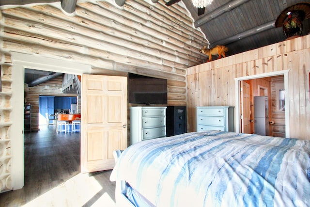 bedroom featuring wood finished floors, wood walls, beam ceiling, high vaulted ceiling, and log walls