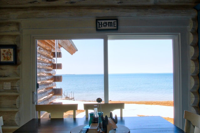 dining space with a water view